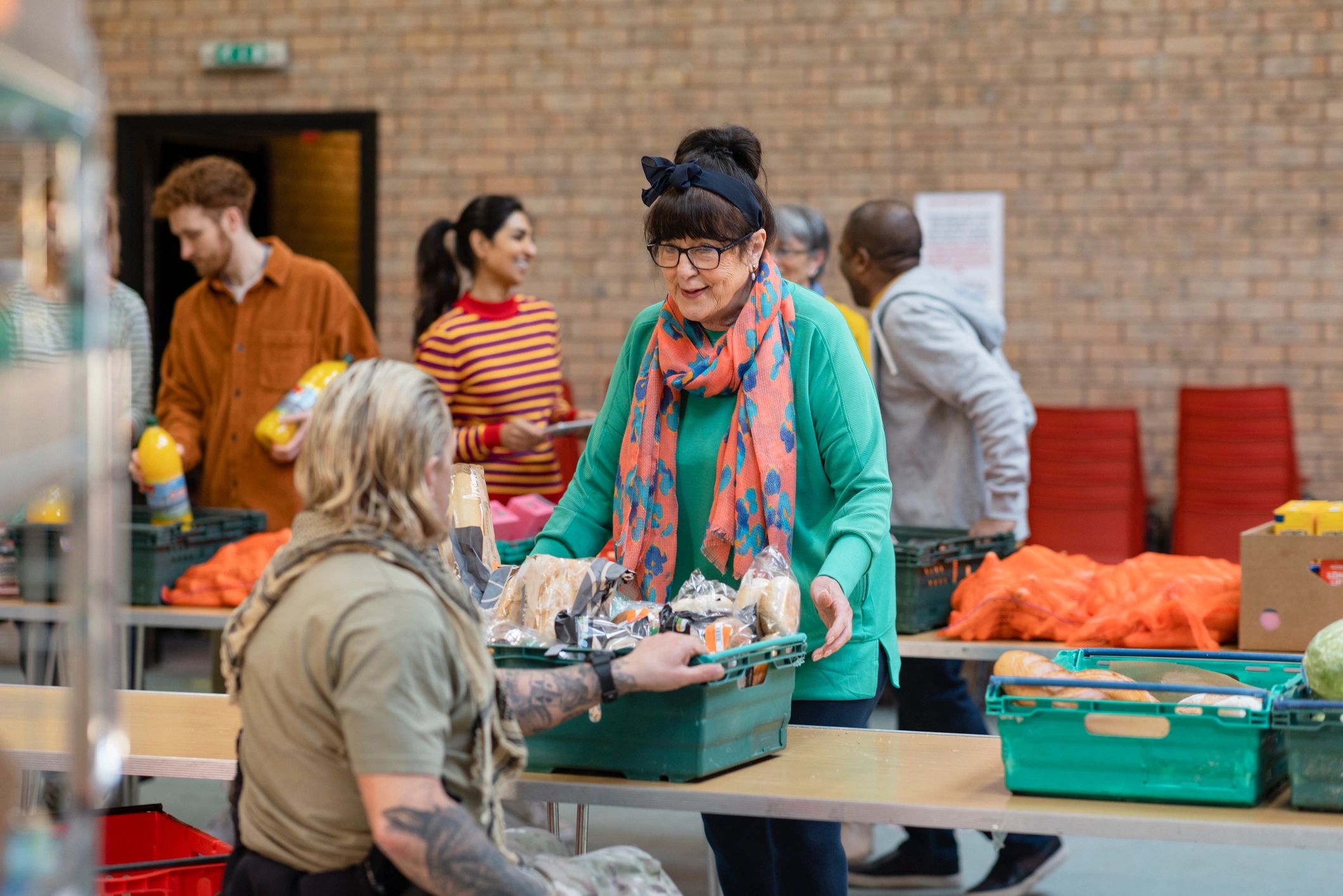 Volunteers organizing donations for a church food drive