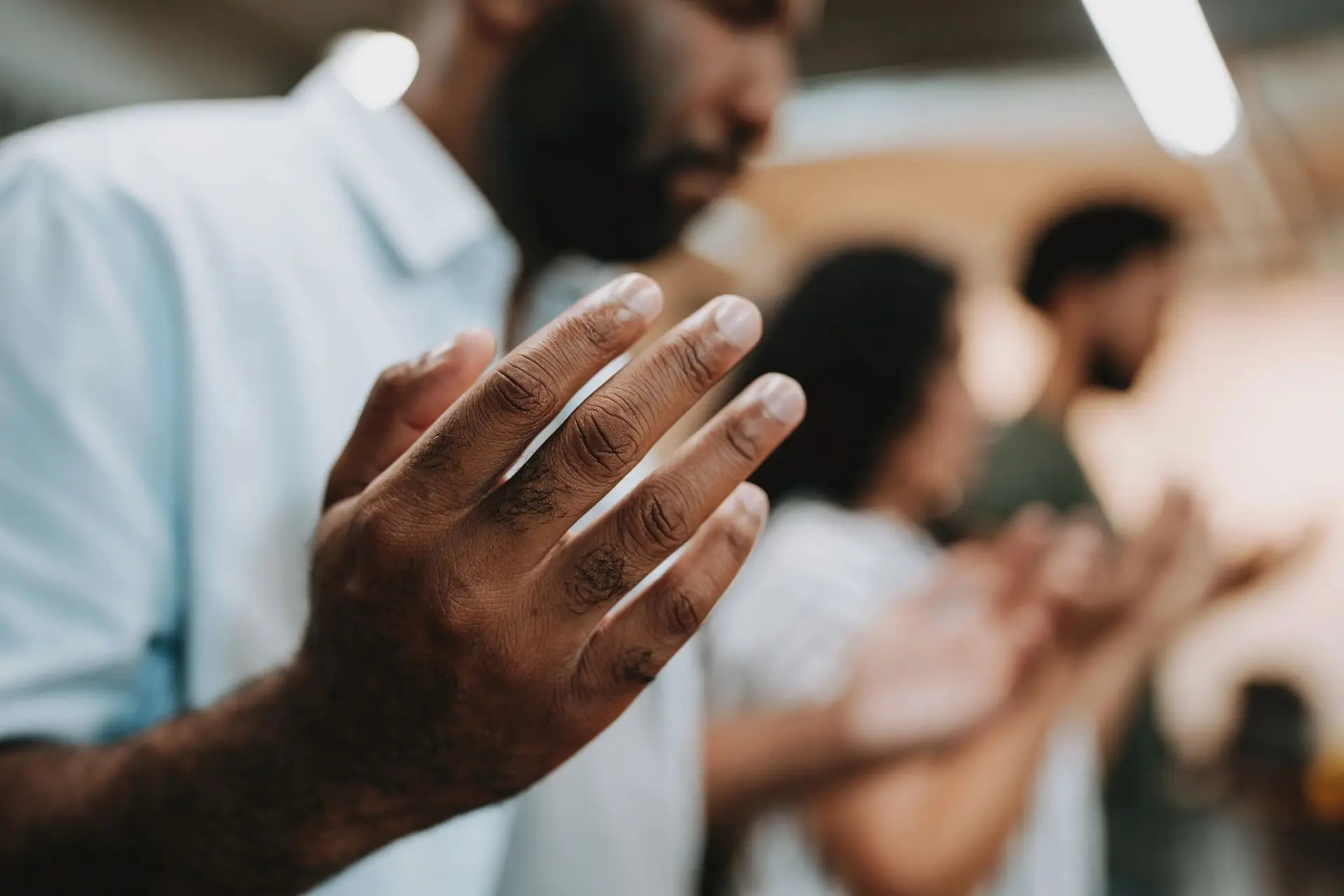 People praying together in a supportive group